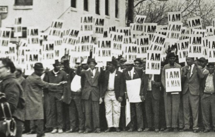 group of black men holding signs that say I Am A Man