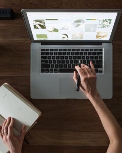 Woman typing on laptop