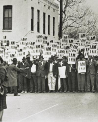 group of black men holding signs that say I Am A Man